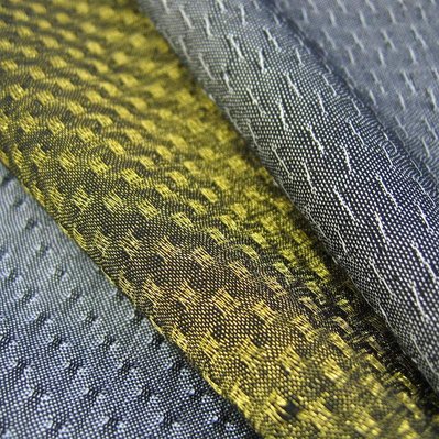 handwoven fabrics made from polyester, metal yarn and titanium film by Joost Post
