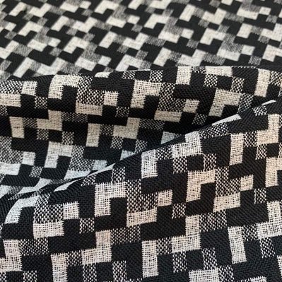 handwoven fabric with a pixelated pattern made from polyester and viscose by Joost Post