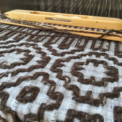 A woven textile made from repurposed yarns.
