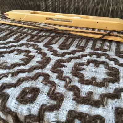 A woven textile made from repurposed yarns.