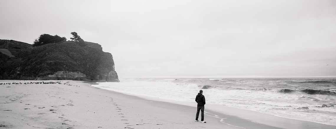 Ryan Jacobs, photographer. Self-portrait at Pomponio Beach in California.