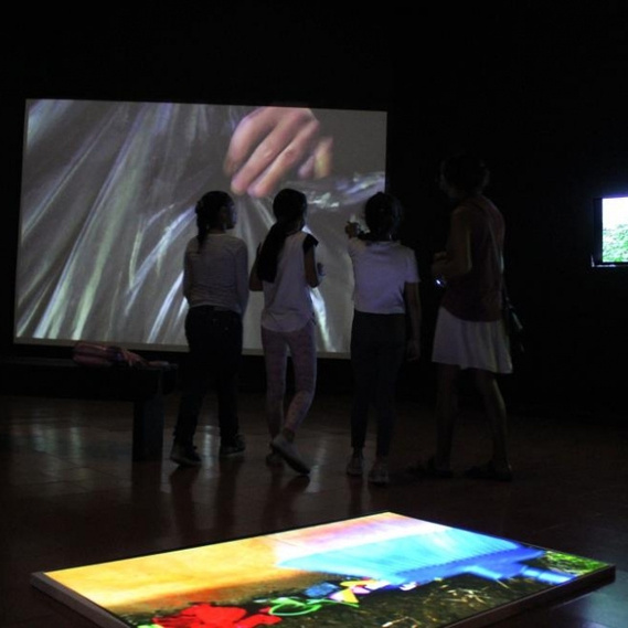 with three young visitors at the Museo Omar Rayo, Roldanillo, Colombia