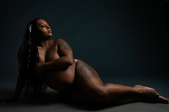 A beautiful pregnant semi nude woman