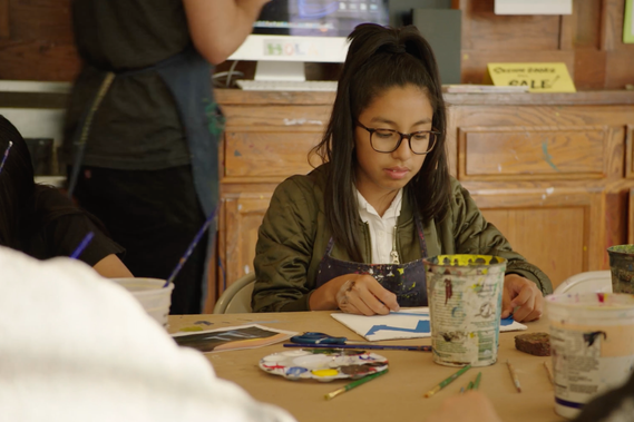 Child in H.O.L.A. arts program