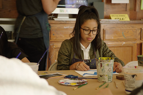 Child in H.O.L.A. arts program
