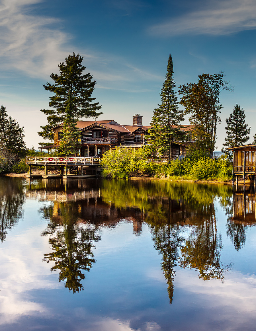 A cottage by the lake on a sunny day