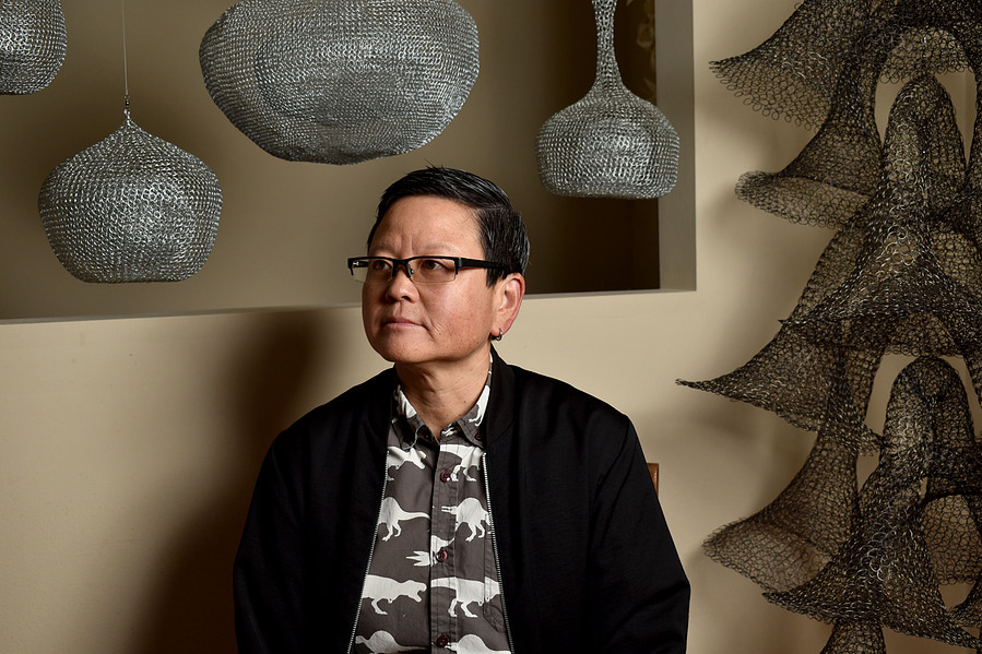 Tina Takemoto, or TT, a non-binary Asian American sculptor, artist, and professor at California College of the Arts, poses for a portrait in their home in Daly City, CA on Oct. 20, 2021. (Karina Patel)