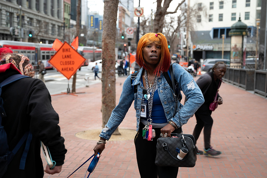 Tiffany Stokes, a community health worker for non-profit SF City Vitals, looks around on Market Street in San Francisco during her outreach on Feb. 15, 2024. (Karina Patel)