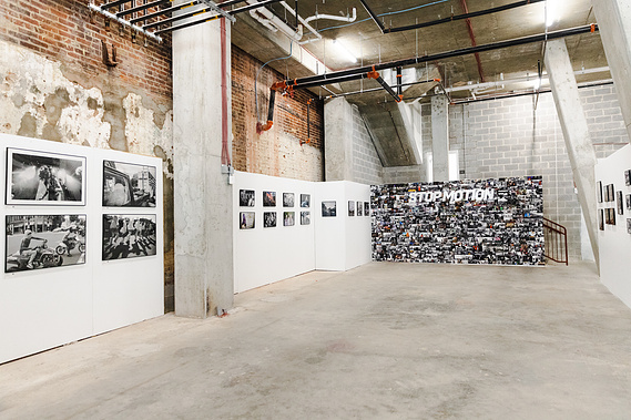 Curator Katie Dance installed a Stop Motion photography collage mural at UMBRELLA art fair presented by No Kings Collective.