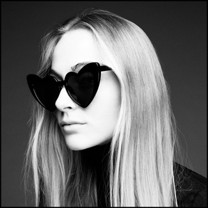 Anna Sophia black and white portrait looking away with heart shaped sunglasses. Paris, by Adam Amouri 