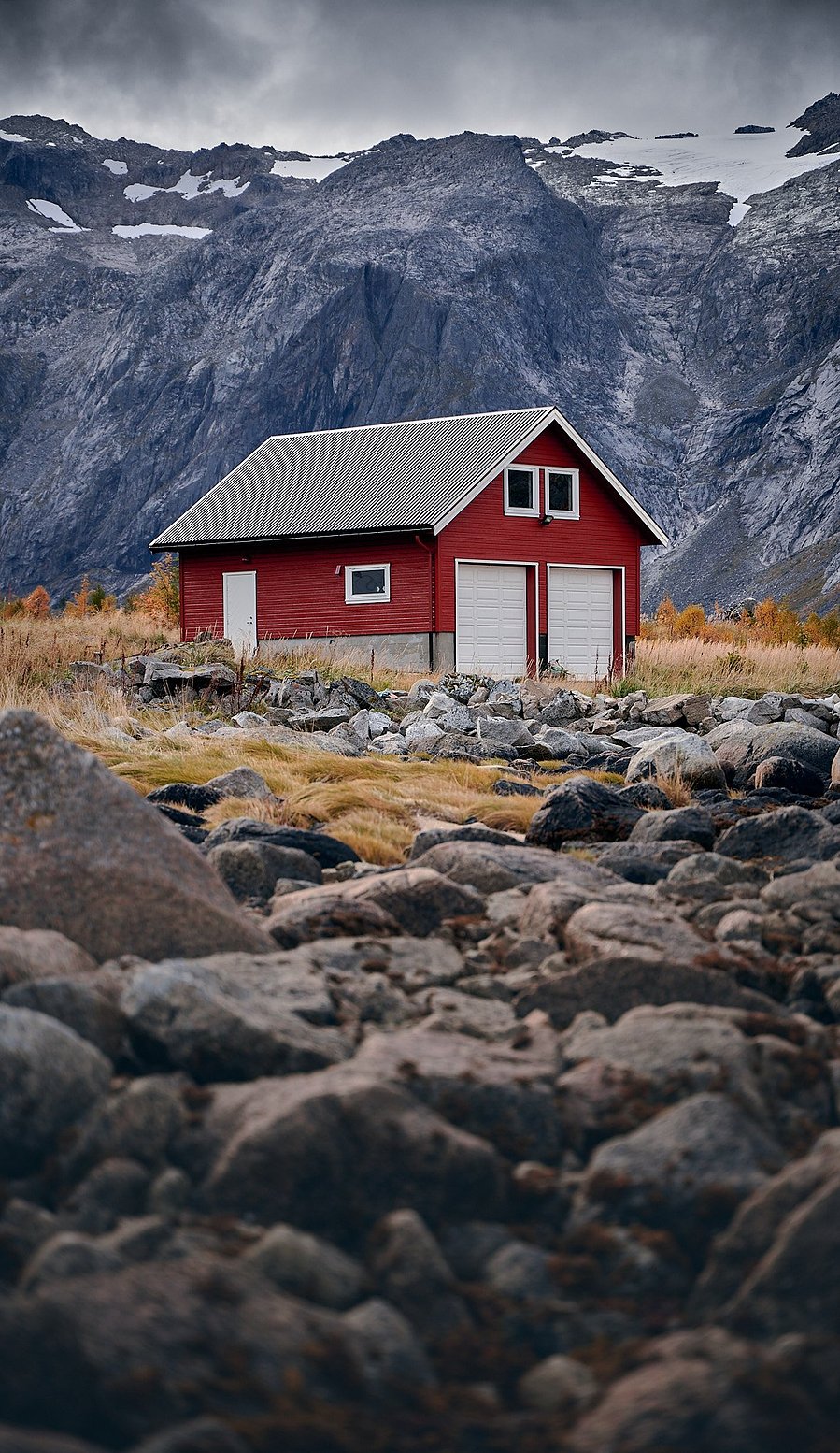 a RED barn in northern norway near tromso. mountains