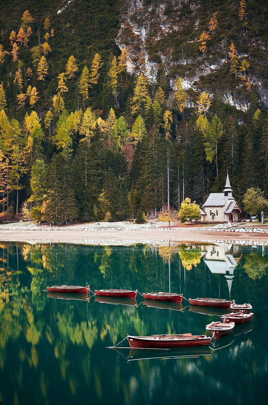 Boats in the Lage di Braies, Italy in the dolomites