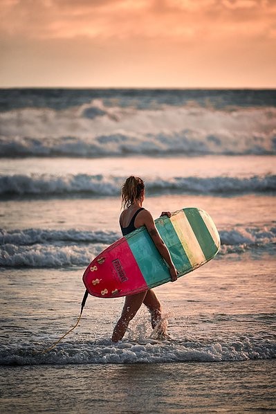 Playa Hermosa, Costa Rica, Surfer at sunset. Near santa teresa. 