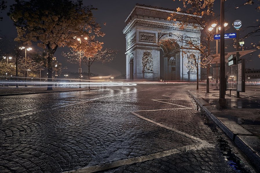A rainy night in France, looking at the Arc d'Triomphe