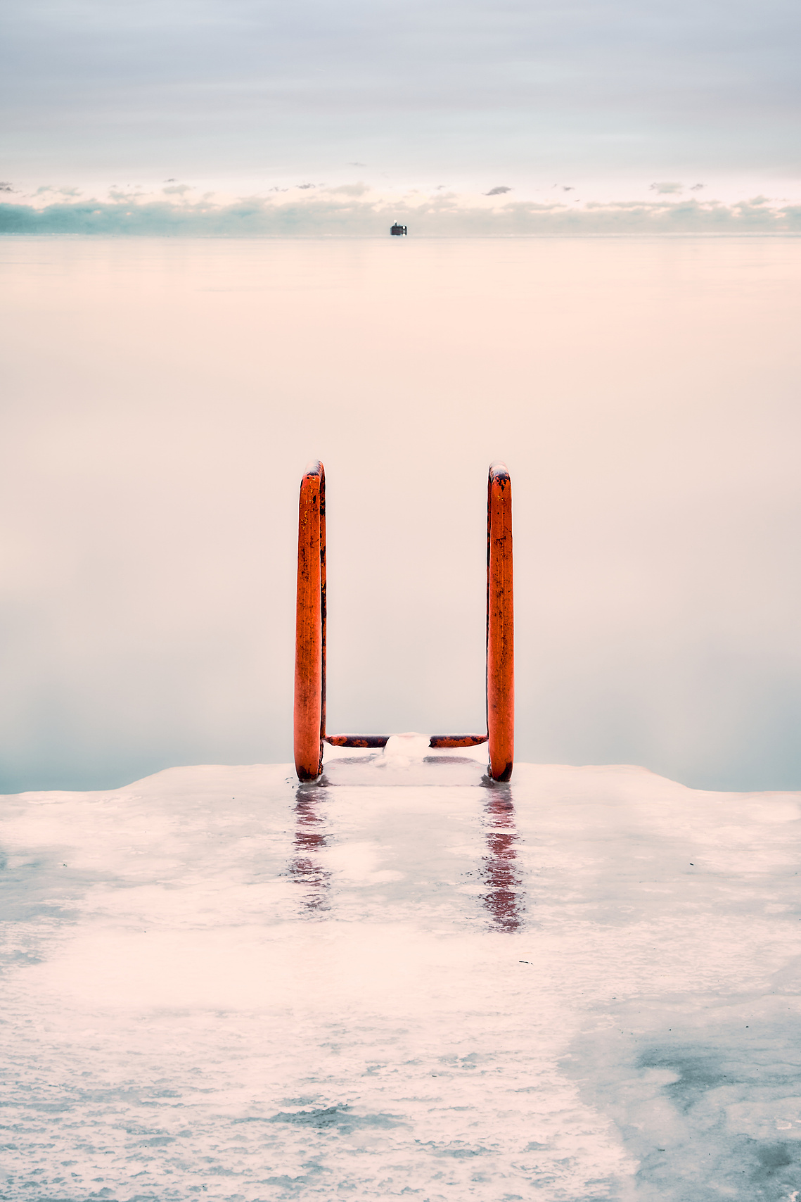 On a cold January day looking over Lake Michigan from the ladder