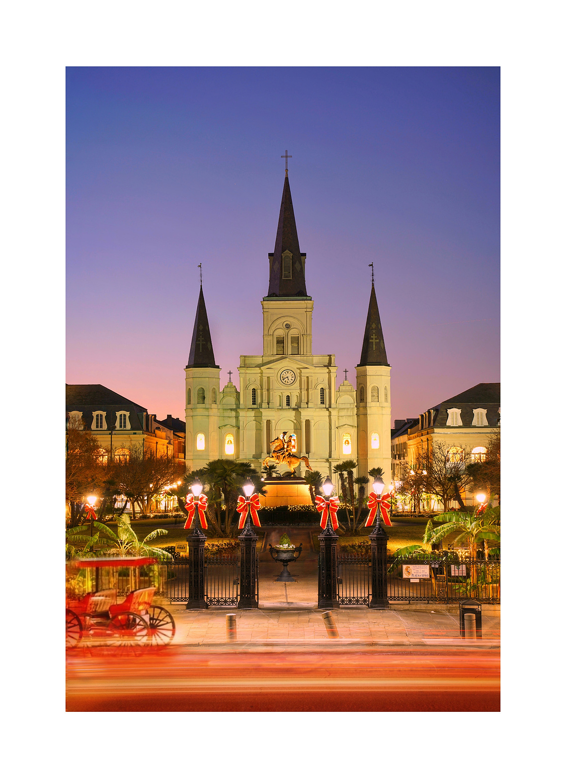Jackson Square at sunset with a horse carriage in New Orleans, Louisana. 