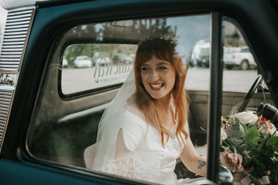Brides arrives at Country Wedding in Courtenay, Vancouver Island in classic car