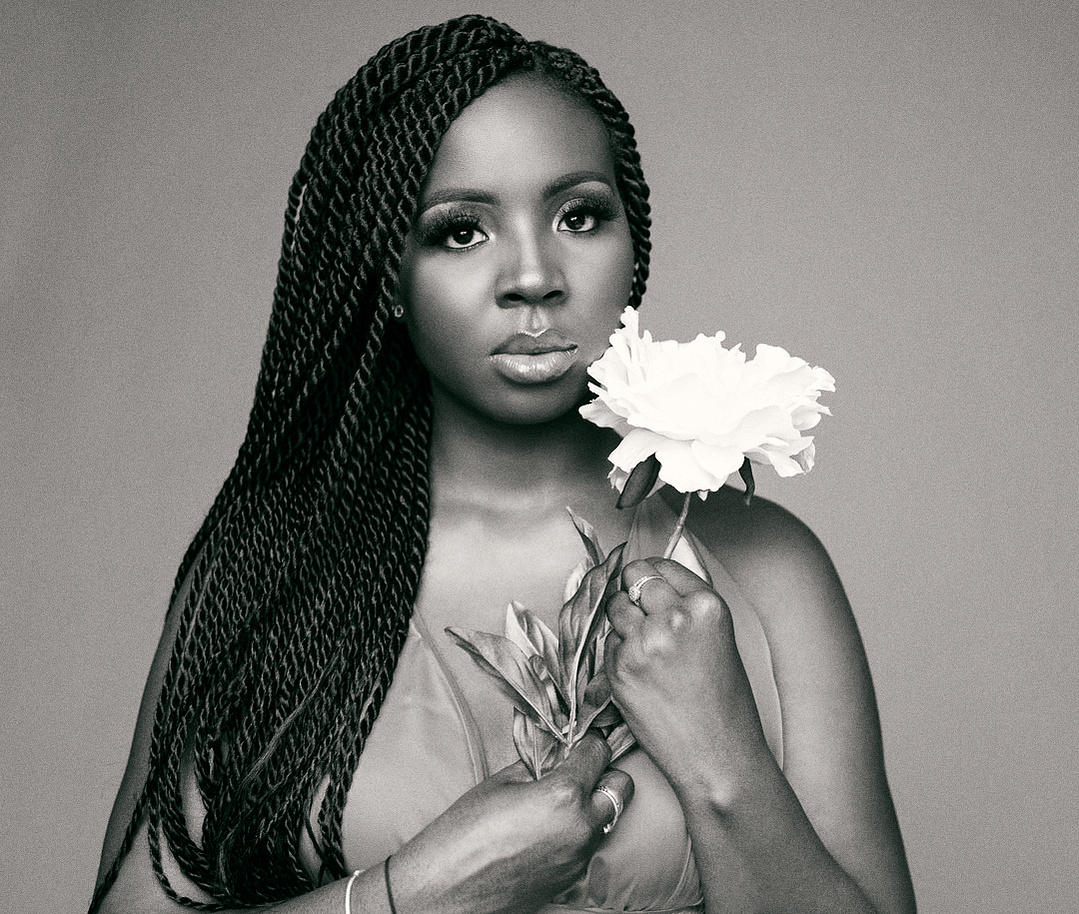 black woman with rose in her hand