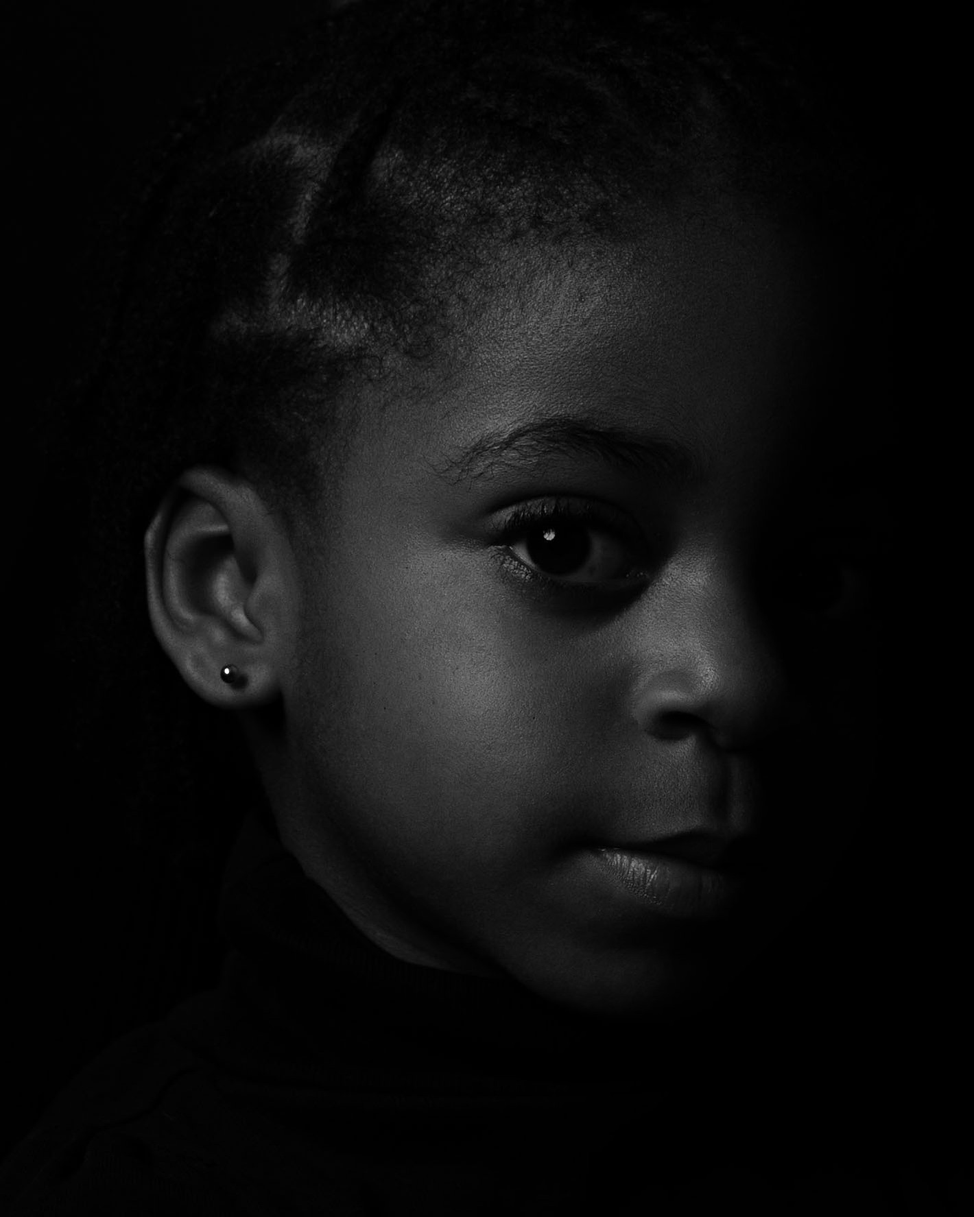 Dramatic Black and white portrait of a 5-year-old African American black child. 