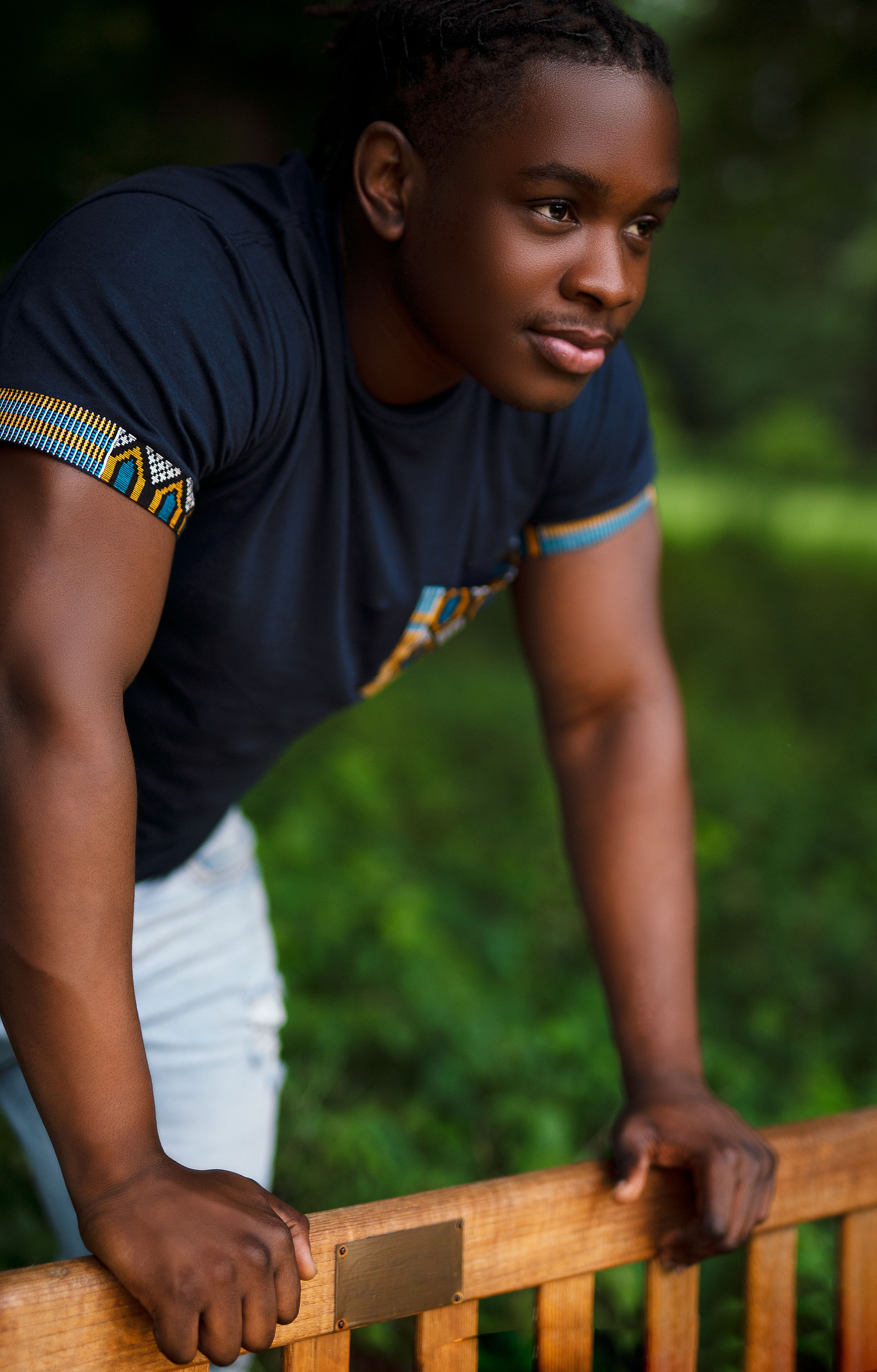 black man holding on to a bench