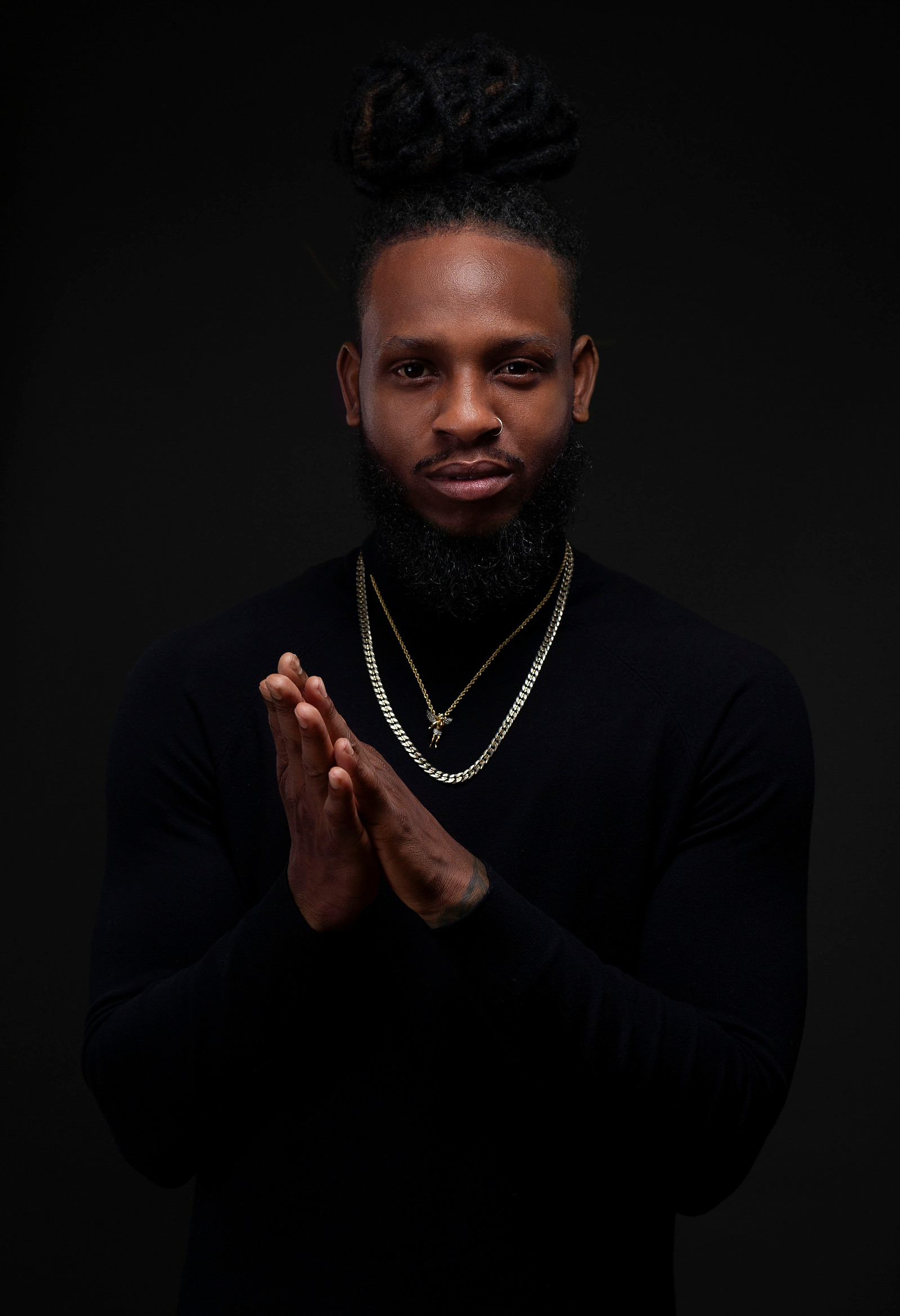 a man in a blak turle neck