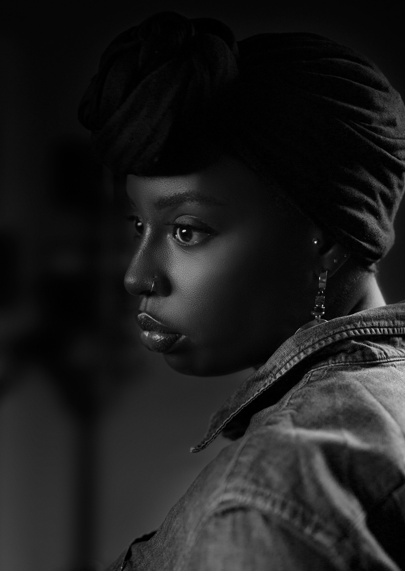 black african woman wearing a black head wrap