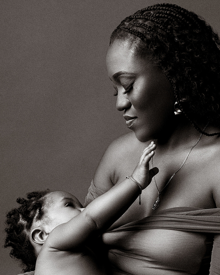 Black woman breast feeding her baby