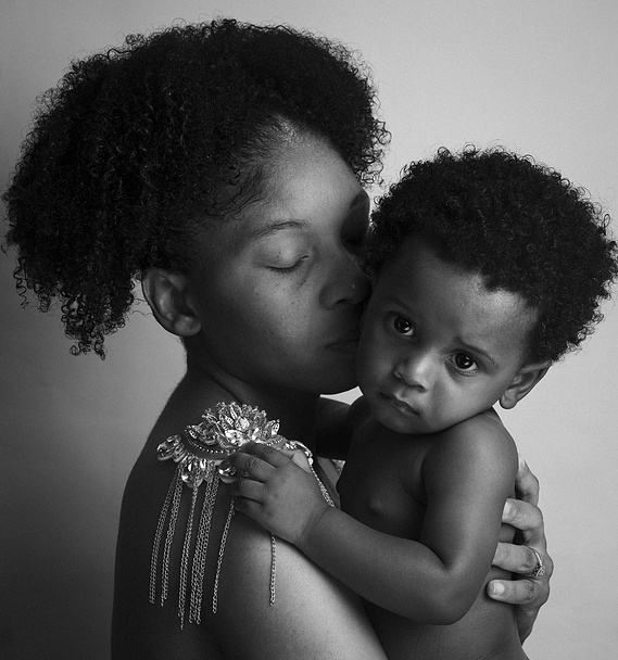 black mother embracing her baby