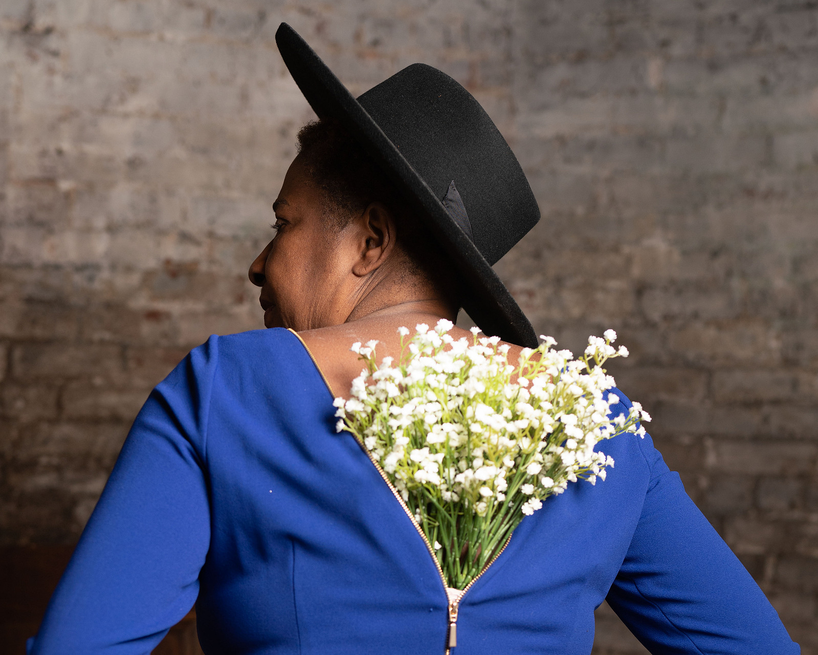 woman with flower blooming from her back