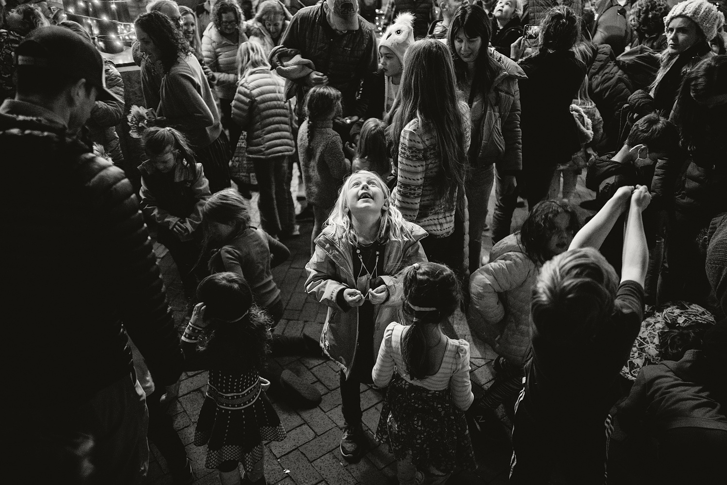 Rudy Ortega. Girl surrounded by crowd.