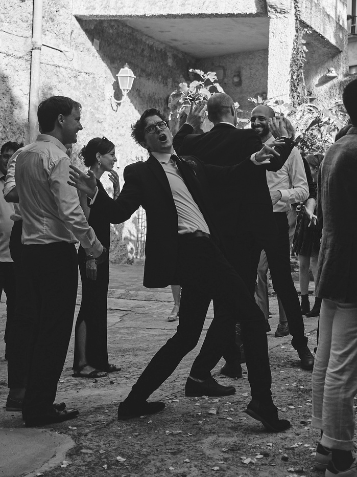 A young man celebrating at an Italian wedding in Castellabate, Italy. Shot on Olympus Pen-F