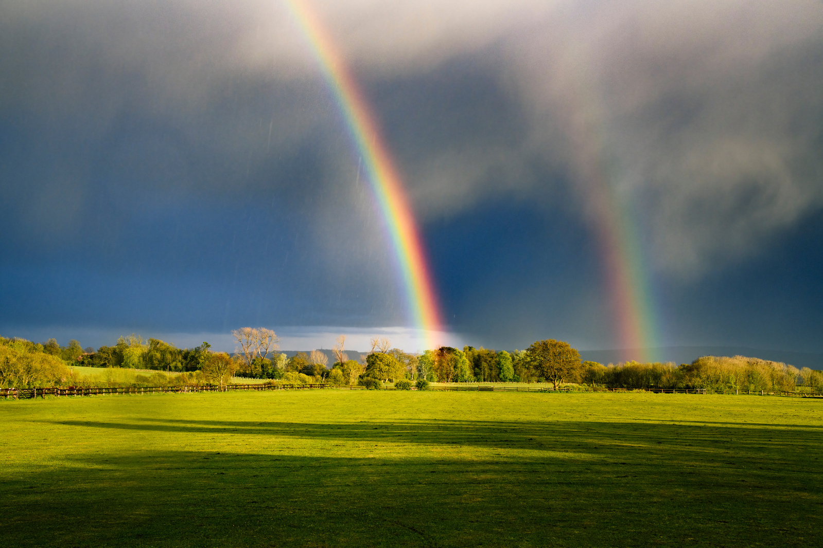 Rainbows in the fields outside our door as the sun sets and a storm has passed, Little Coxwell, Oxfordshire.