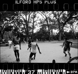 Locals playing soccer together at a park in Washington dc. 


