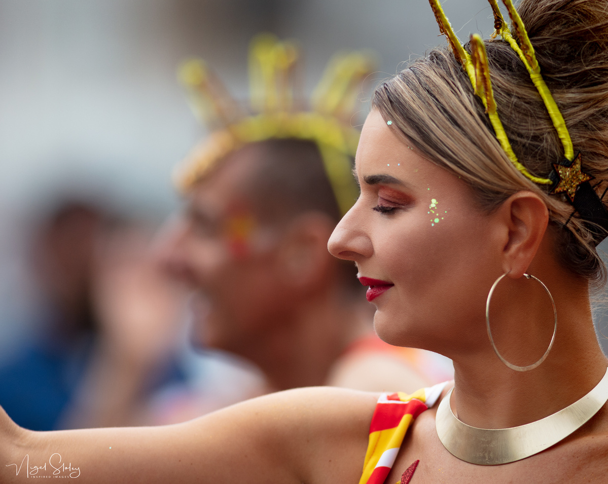 Wellington Batucada lead female dancer in full costume gazing into the distance shot by Nigel Sloley Photography at New Zealand's Cuba Dupa Street carnival in Wellington.