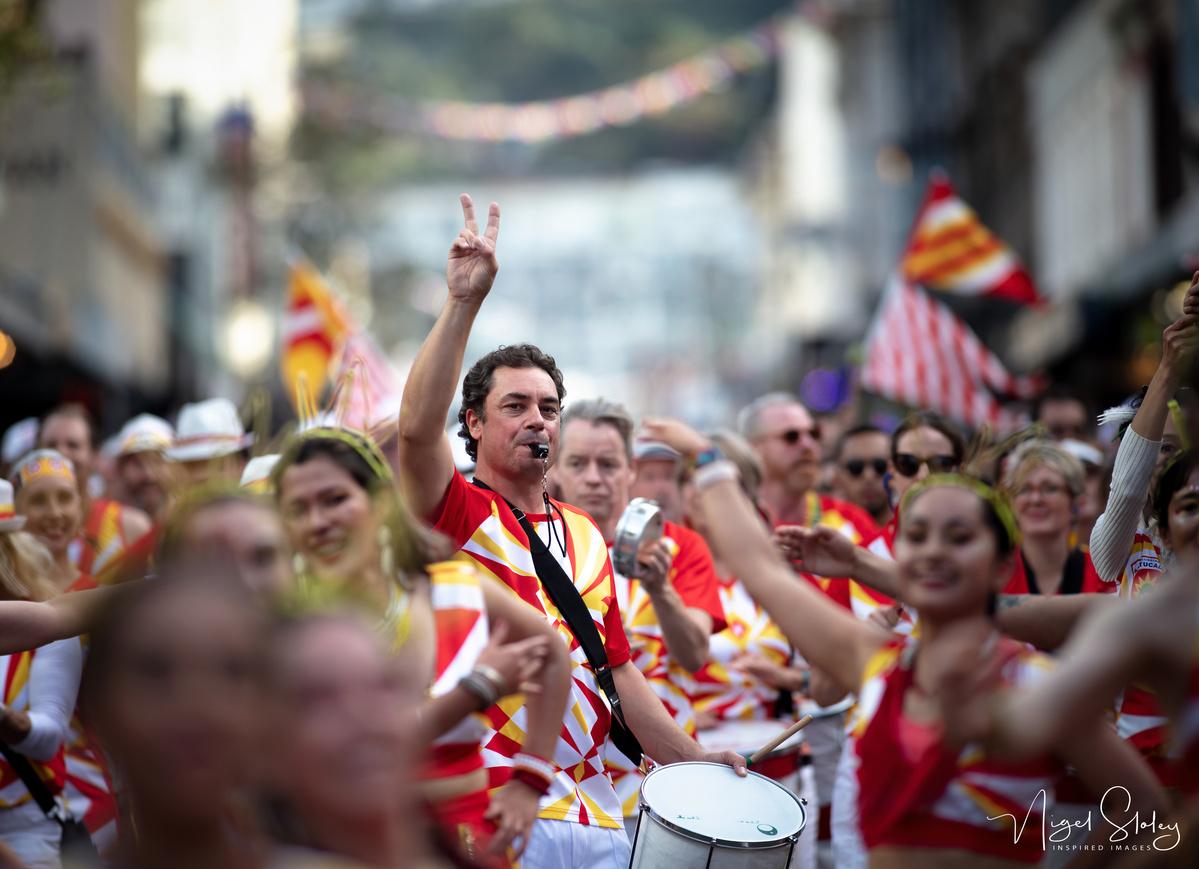 Wellington Batucada musical director directing the Bateria shot by Nigel Sloley Photography at New Zealand's Cuba Dupa Street carnival in Wellington.