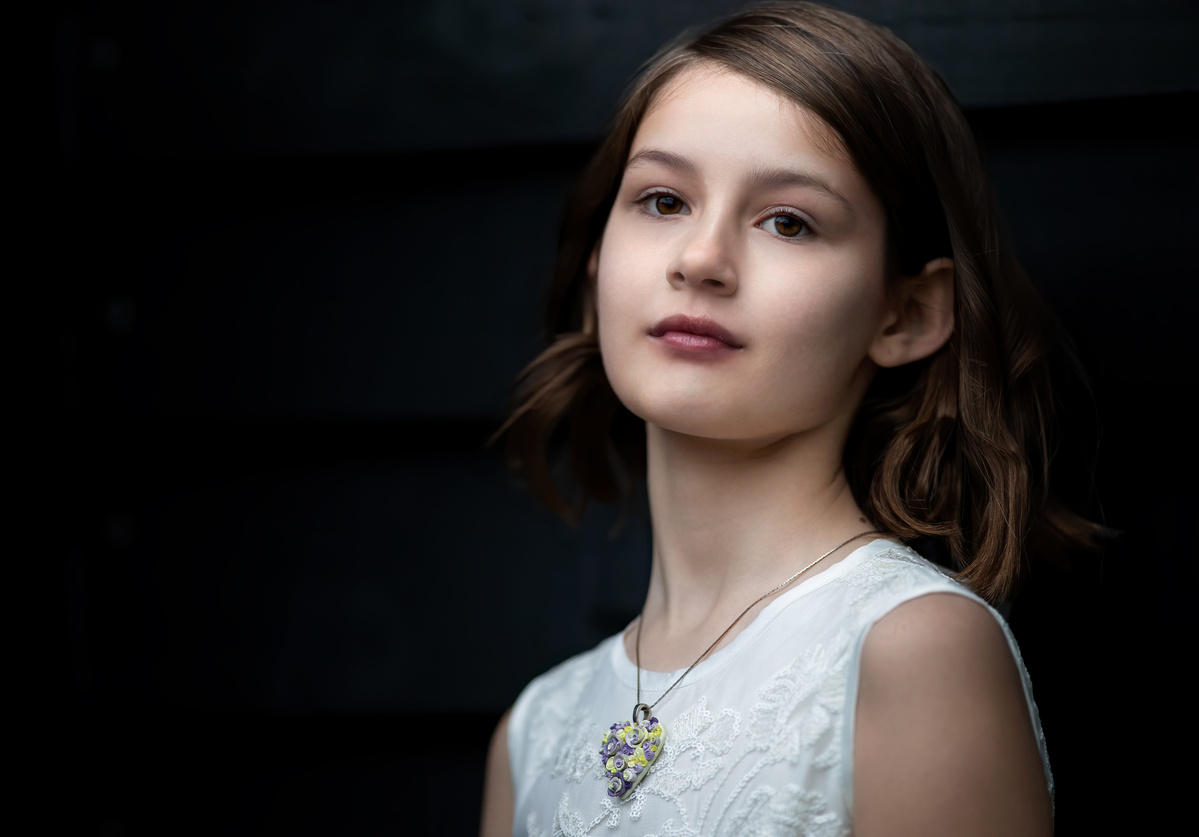 Portrait of Jacqueline wearing a Hearts and Roses necklace, jewelry shot by Nigel Sloley Photography.