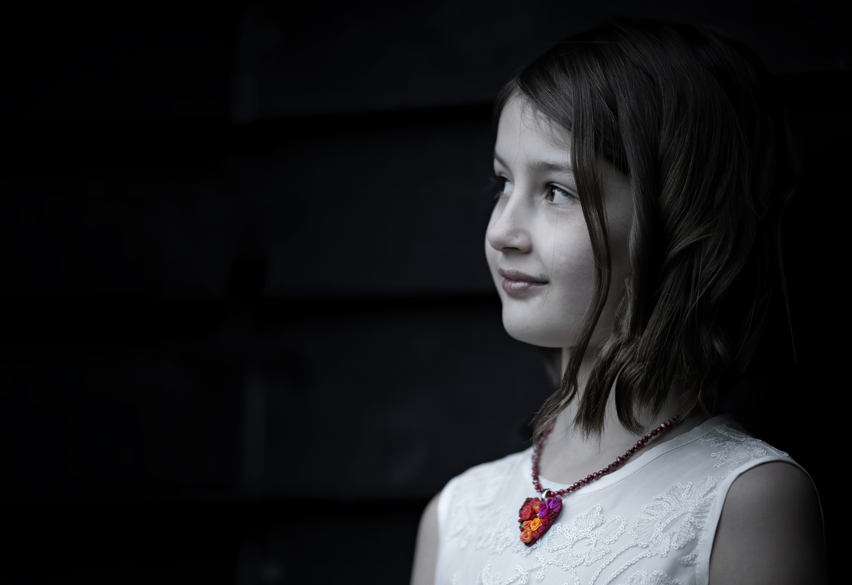 Portrait of Jacqueline wearing a Hearts and Roses necklace, jewelry shot by Nigel Sloley Photography.