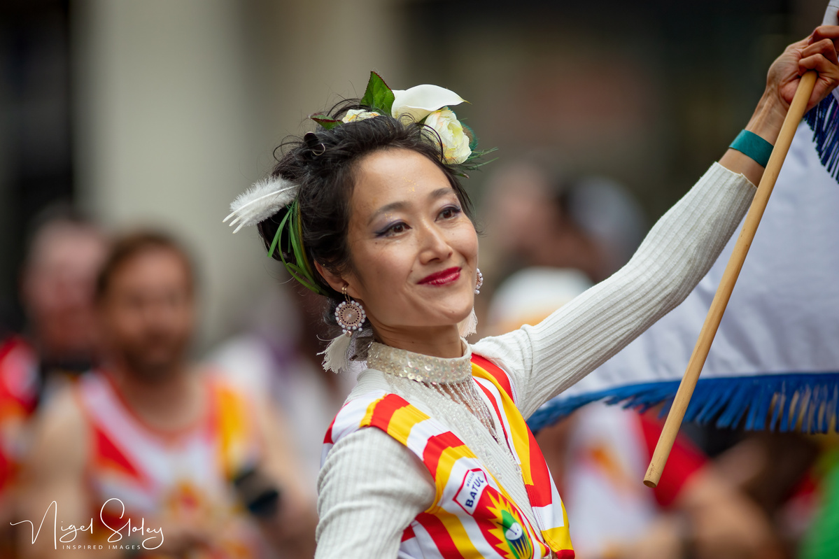 Wellington Batucada Japanese dancer and flag bearer shot by Nigel Sloley Photography at New Zealand's Cuba Dupa Street carnival in Wellington. 