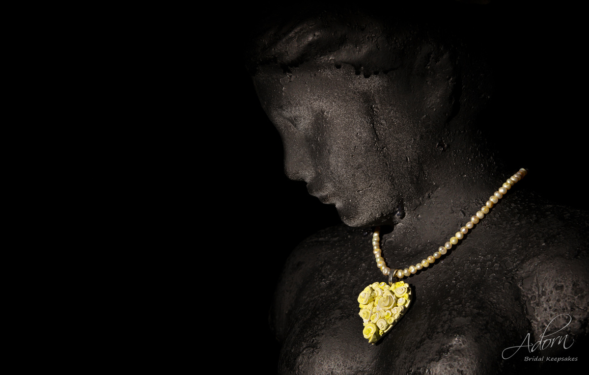 Hearts and Roses necklace on a black bust shot by Nigel Sloley Photography.