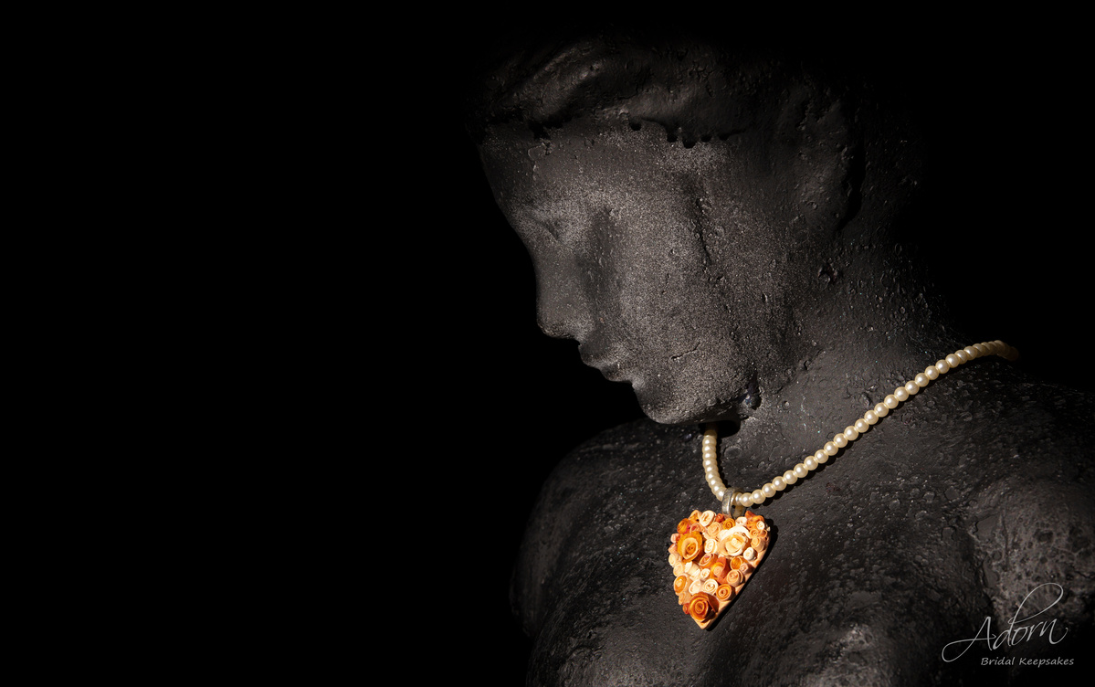 Hearts and Roses necklace on a black bust shot by Nigel Sloley Photography.