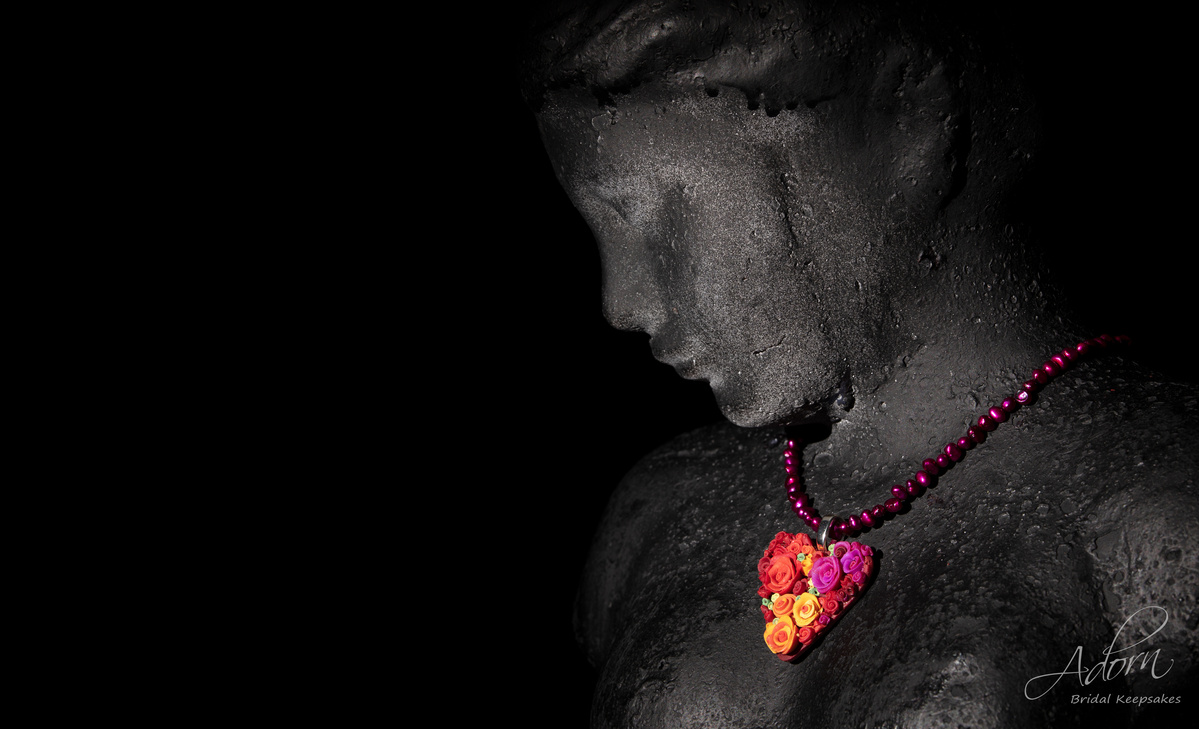 Hearts and Roses necklace on a black bust shot by Nigel Sloley Photography.