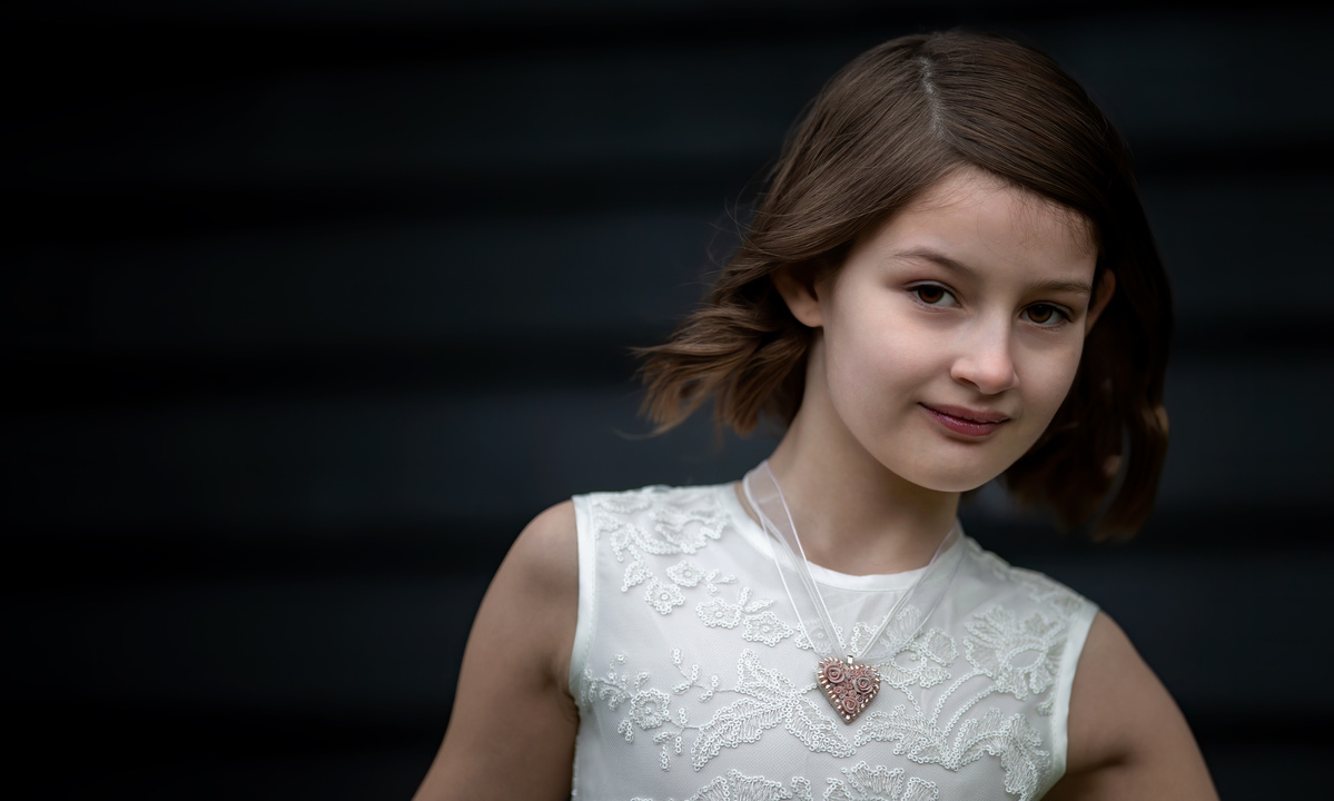 Portrait of Jacqueline wearing a Hearts and Roses necklace, jewelry shot by Nigel Sloley Photography.