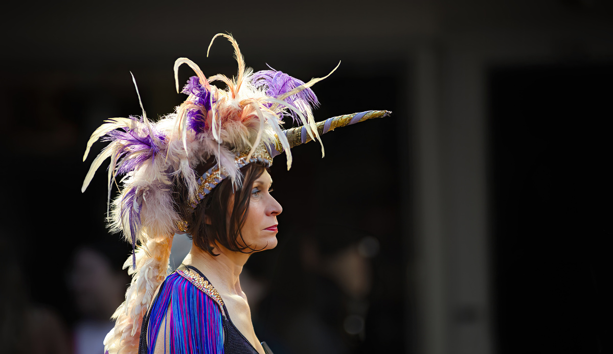 Feathers and Ribbon in Cuba Street in Wellington New Zealand during the 2024 Cuba Street carnival. shot by Nigel Sloley Photography. Canon 1DX mkii 200mm f1.8