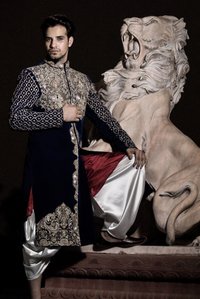 mens wear fashion shoot by fashion photographer with male model and lion statue in india by ashish gurbani top fashion photographer in mumbai and pune india