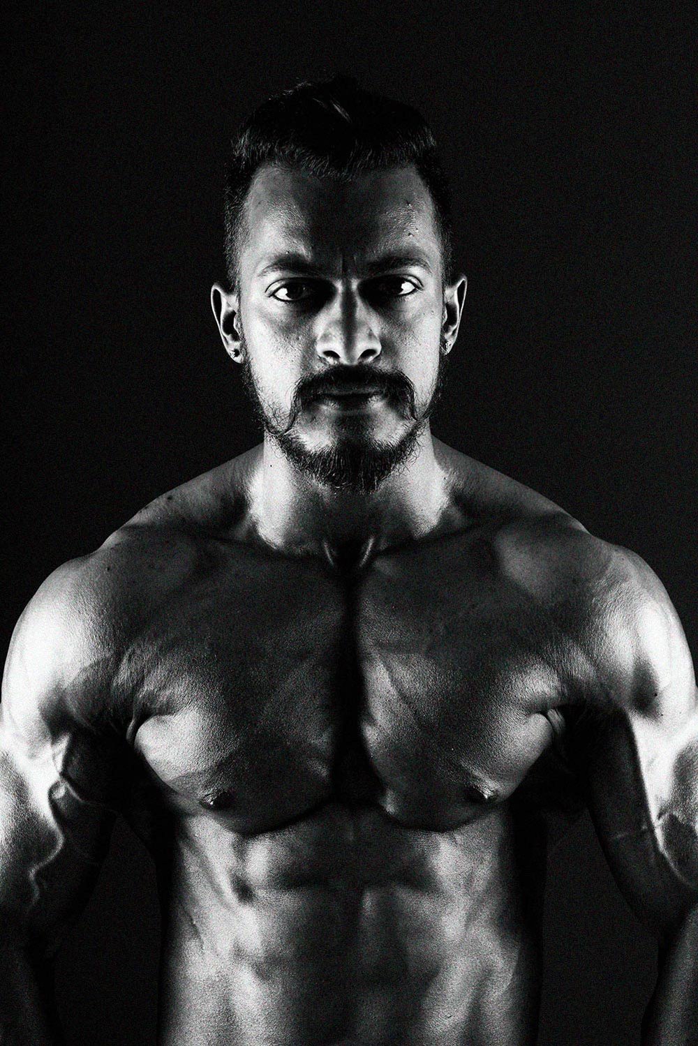 bodybuilder black and white shoot by best portrait photographer based in pune india