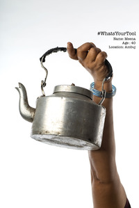 a tea selling holds up a  kettle to she her pride and honour in her tool used to sell tea photoshoot series concept by top indian concept photographer based in mumbai
