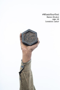 a vegetable vendor holding up a weighing weight as his tool of pride used to weigh vegetables photoshoot concept series by top indian fashion photographer based in bandra mumbai