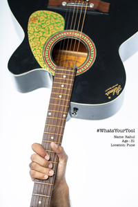a musician holds a guitar as his tool of choice for a conceptual series photoshoot by best indian commercial photographer based in mumbai india