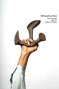 a personal project of a cobbler holding up his anvil as his tool of pride in his profession photoshoot by top indian advertising photographer based in mumbai india