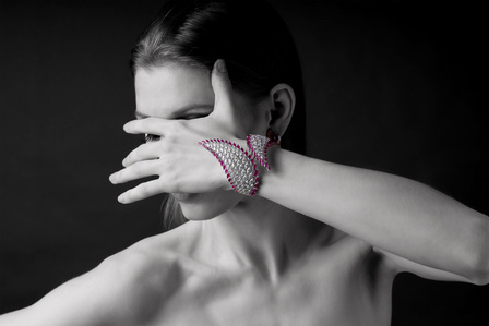 black and white model poses with signature diamond bangles designed by top jewellery designer from mumbai yoube jewellery shoot with the best fashion photographer based in mumbai india